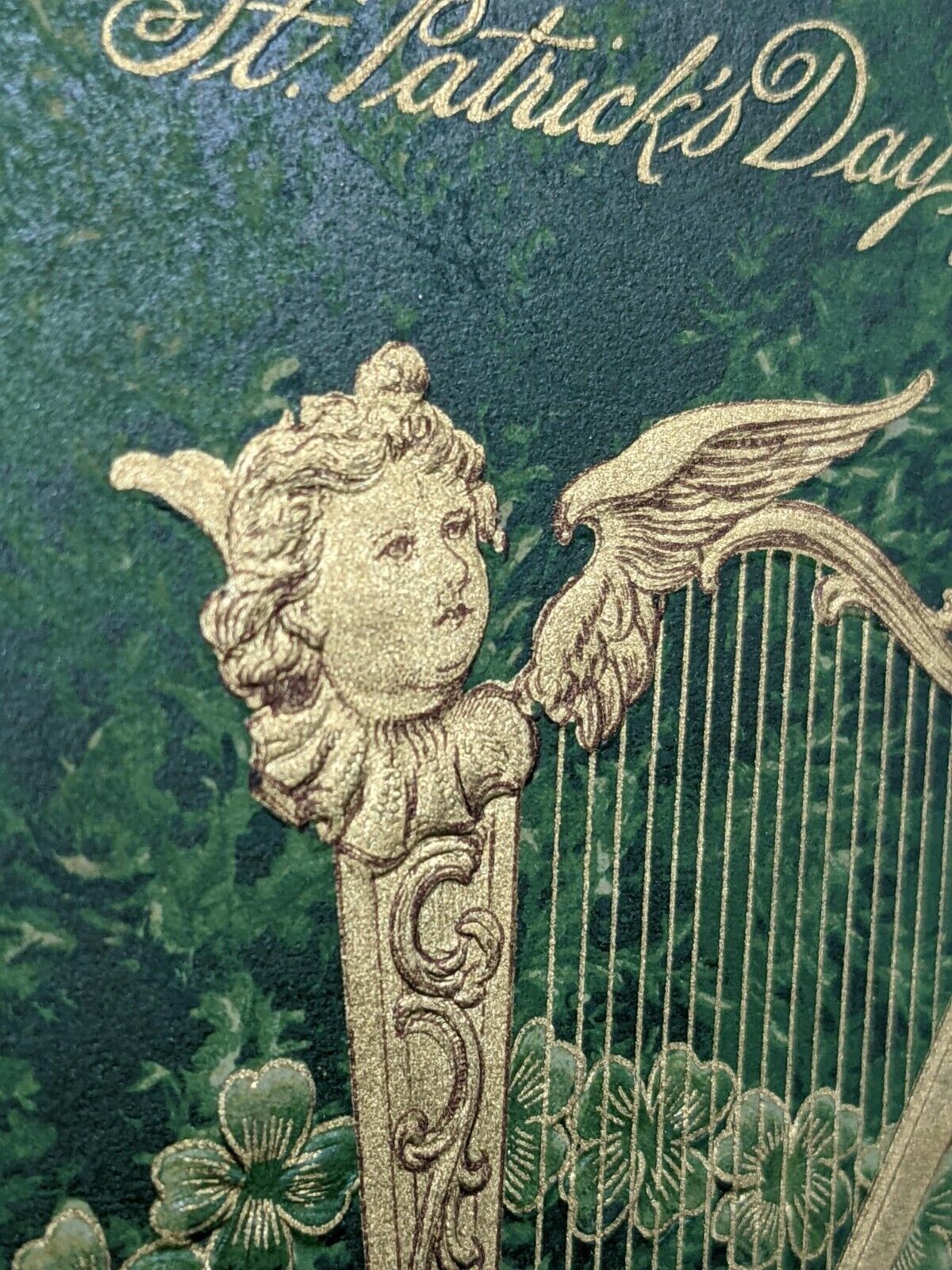 St Patrick's Day Gold Harp with Face Surrounded by Embossed Shamrocks Postcard