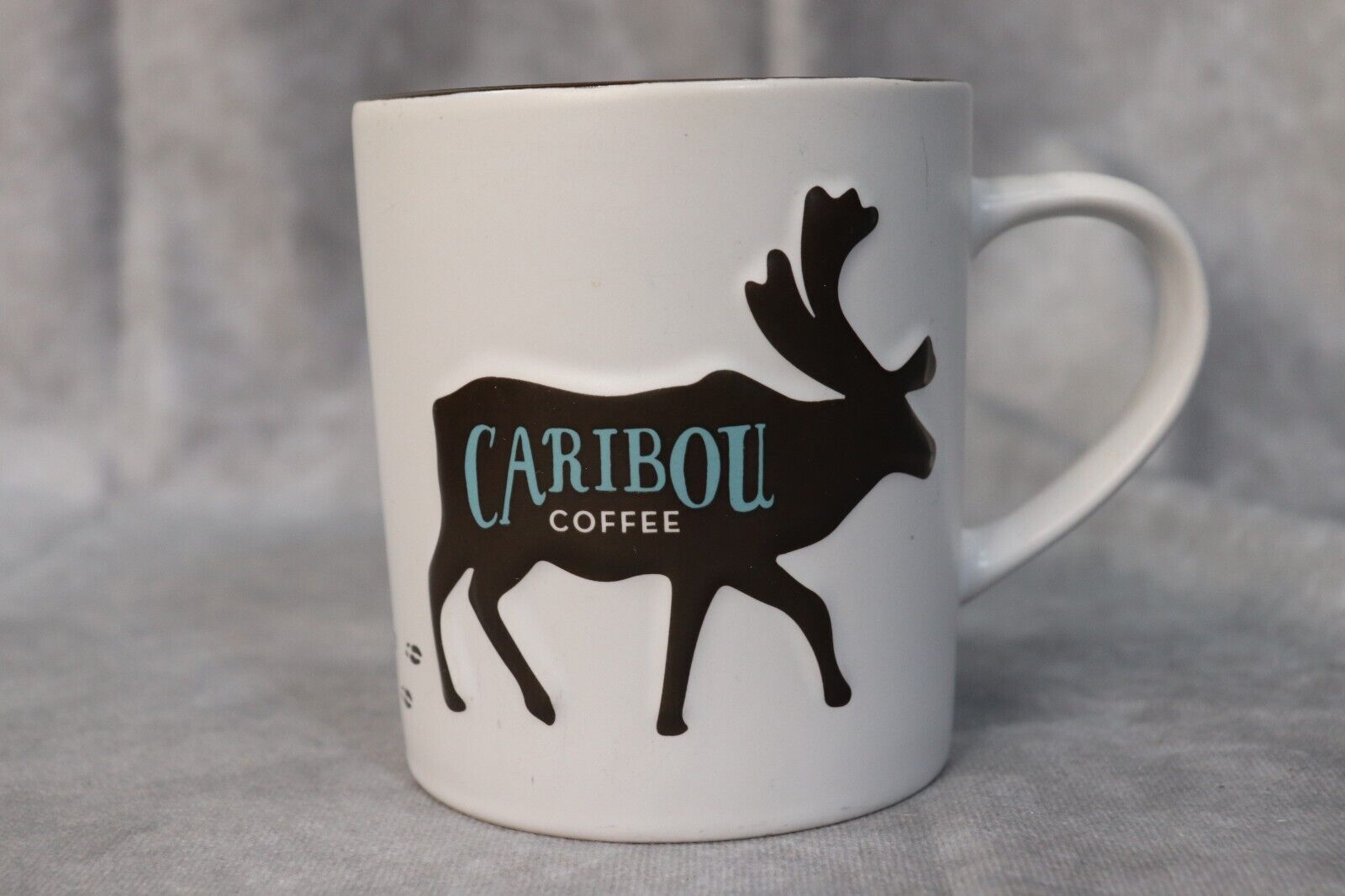 Caribou Coffee 2013 White Ceramic Mug Textured Moose Logo 16 Ounce