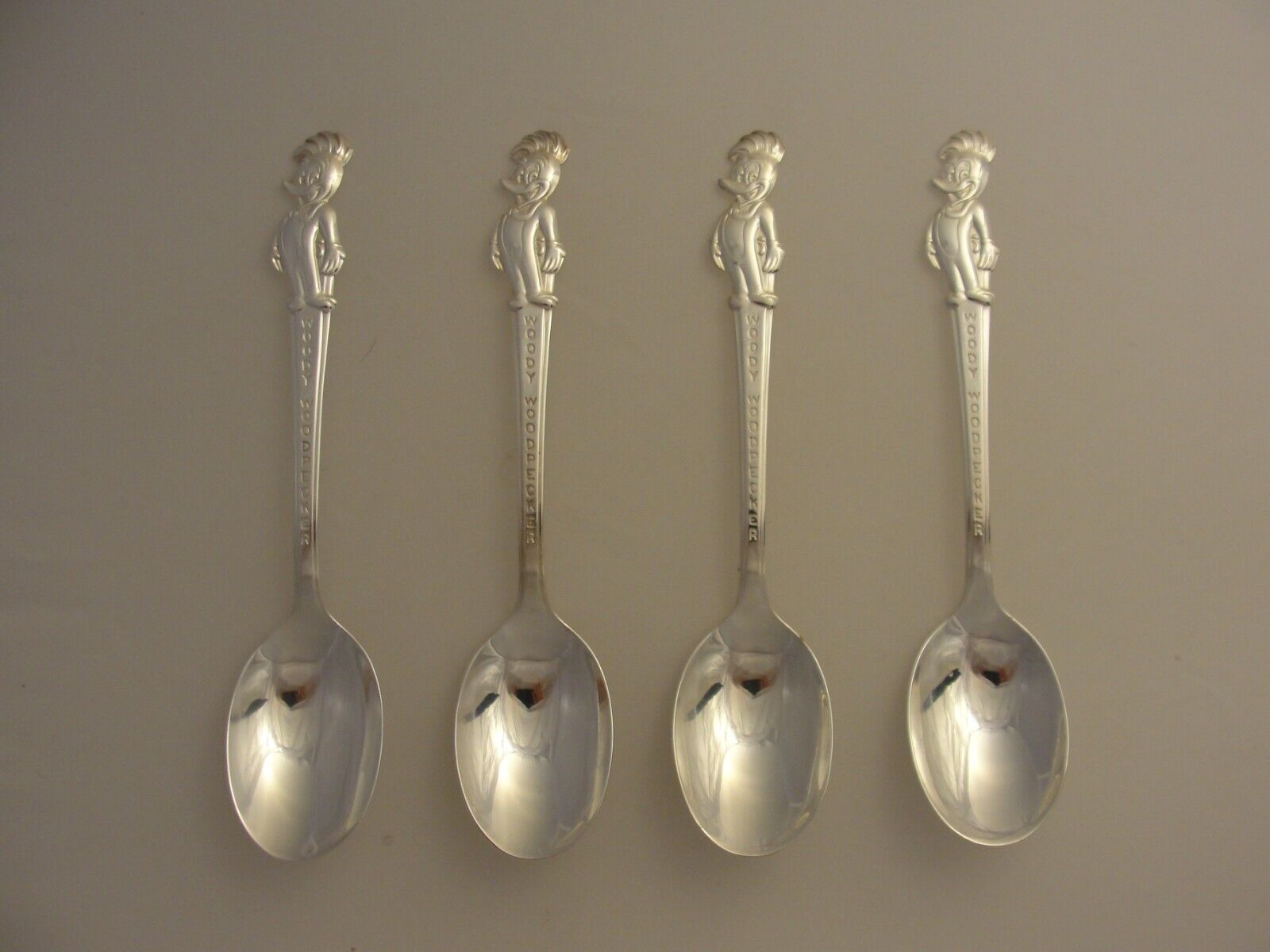 4 VTG WOODY THE WOODPECKER SILVER PLATE CEREAL SPOONS NEW OLD STOCK
