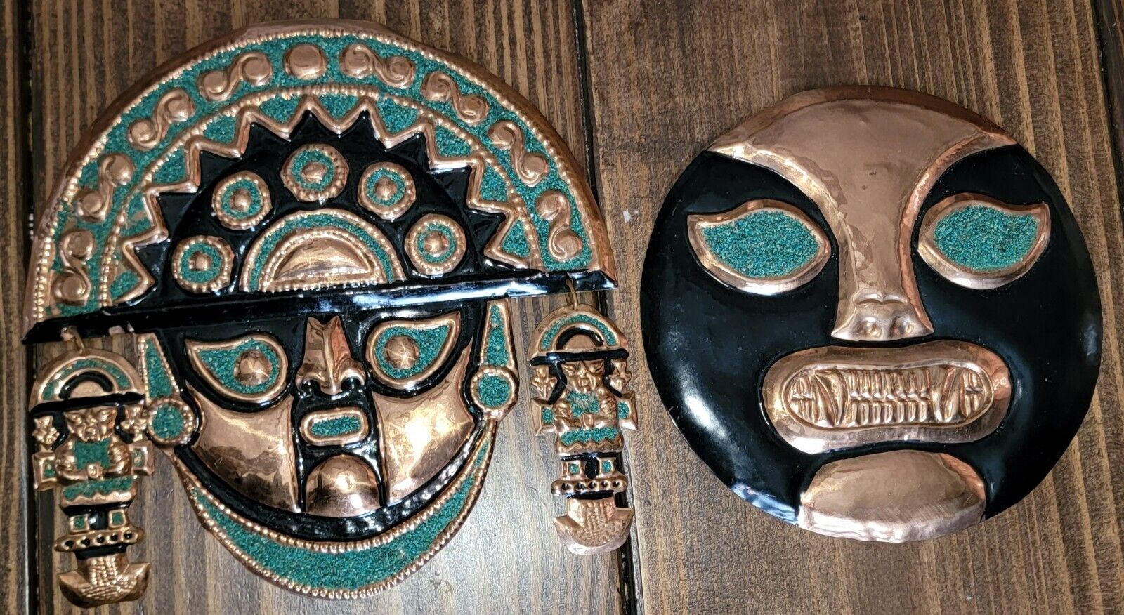 Two Peruvian masks in bronze natural stone inca design