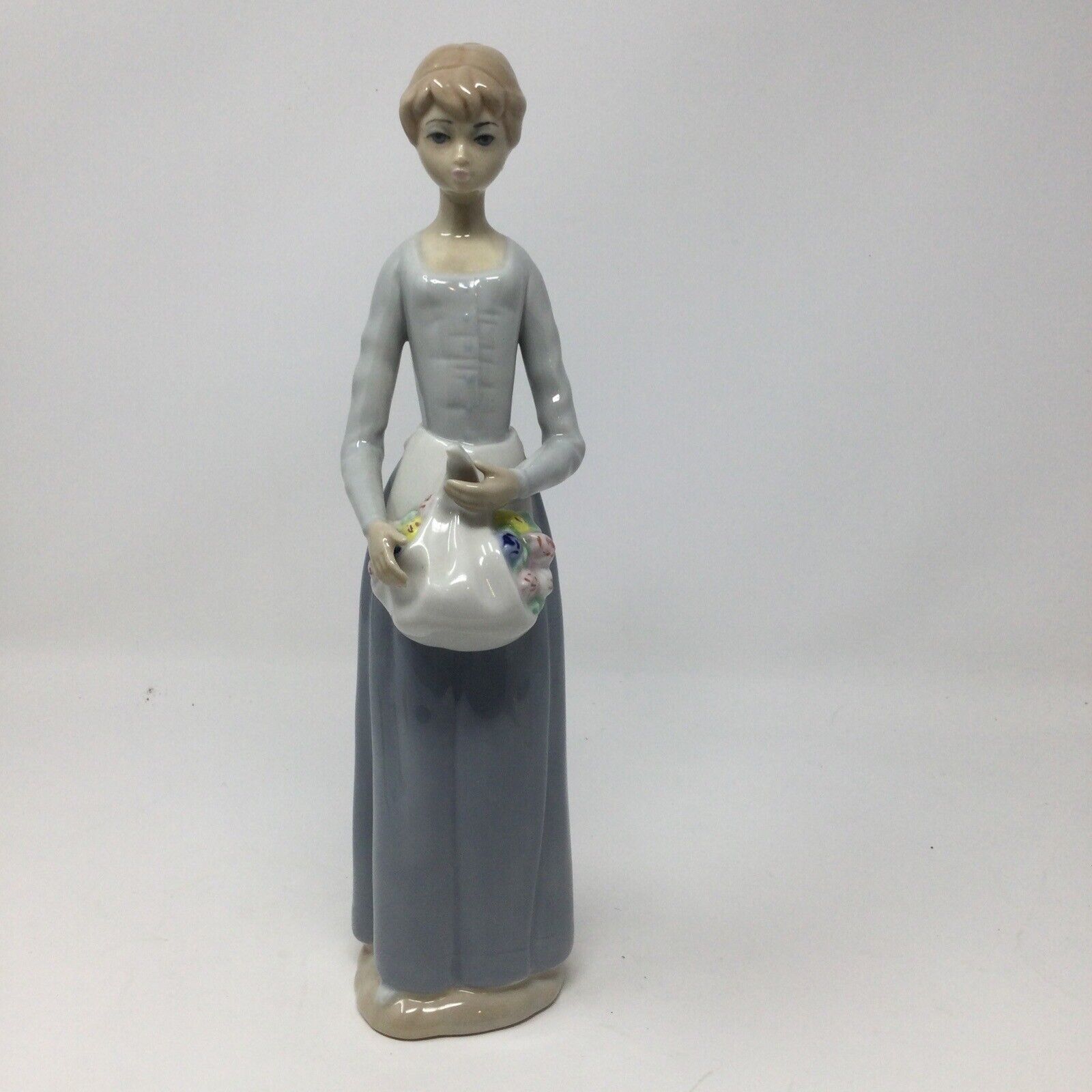 Casades Porcelain Figurine Lady With Flowers. Approximately 12”. Spain