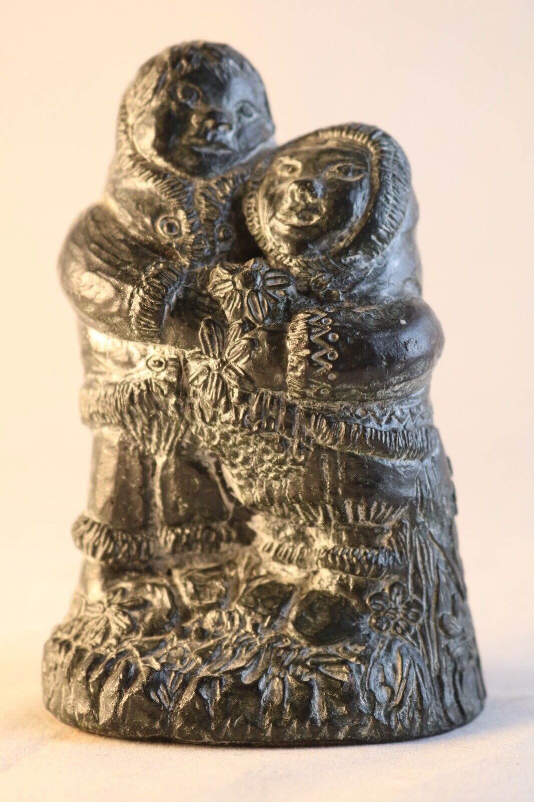 A WOLF ORIGINAL HAND CARVED NORTHERN NATIVE AMERICAN INUIT COUPLE IN LOVE