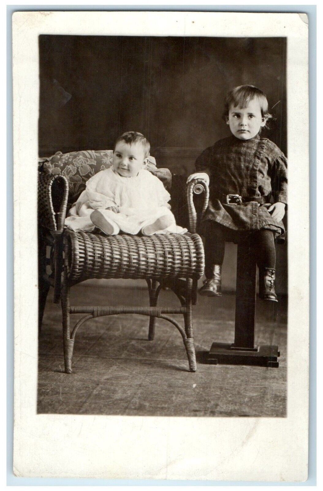 c1910's Baby Girl And Boy Unique Wicker Chair Studio RPPC Photo Antique Postcard