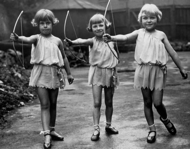 Three members \'Rosebud\' dancing troupe, seen here dressed as Cupid- 1930s Photo