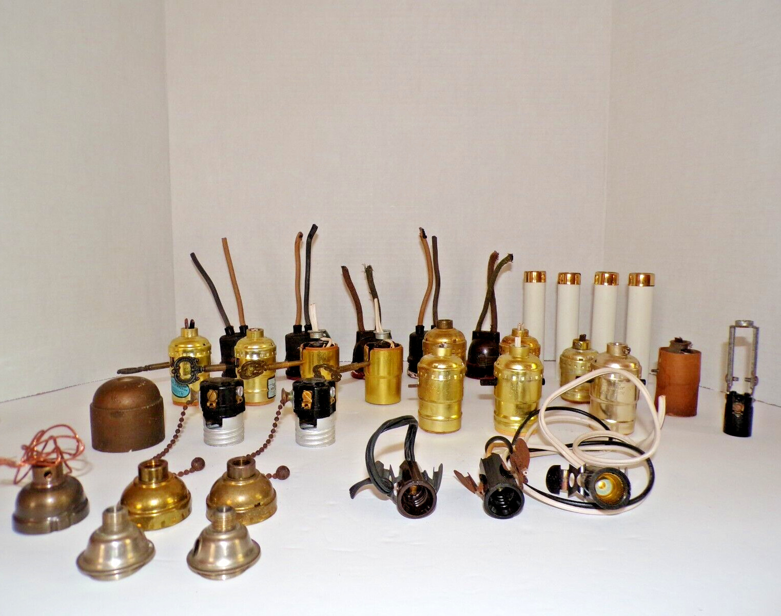 Vintage, lot of 32 assorted lamp/light/chandelier sockets/guts/candle covers.