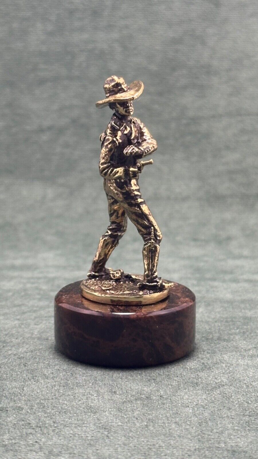 Art deco. Bronze sculpture of a cowboy with a pistol.