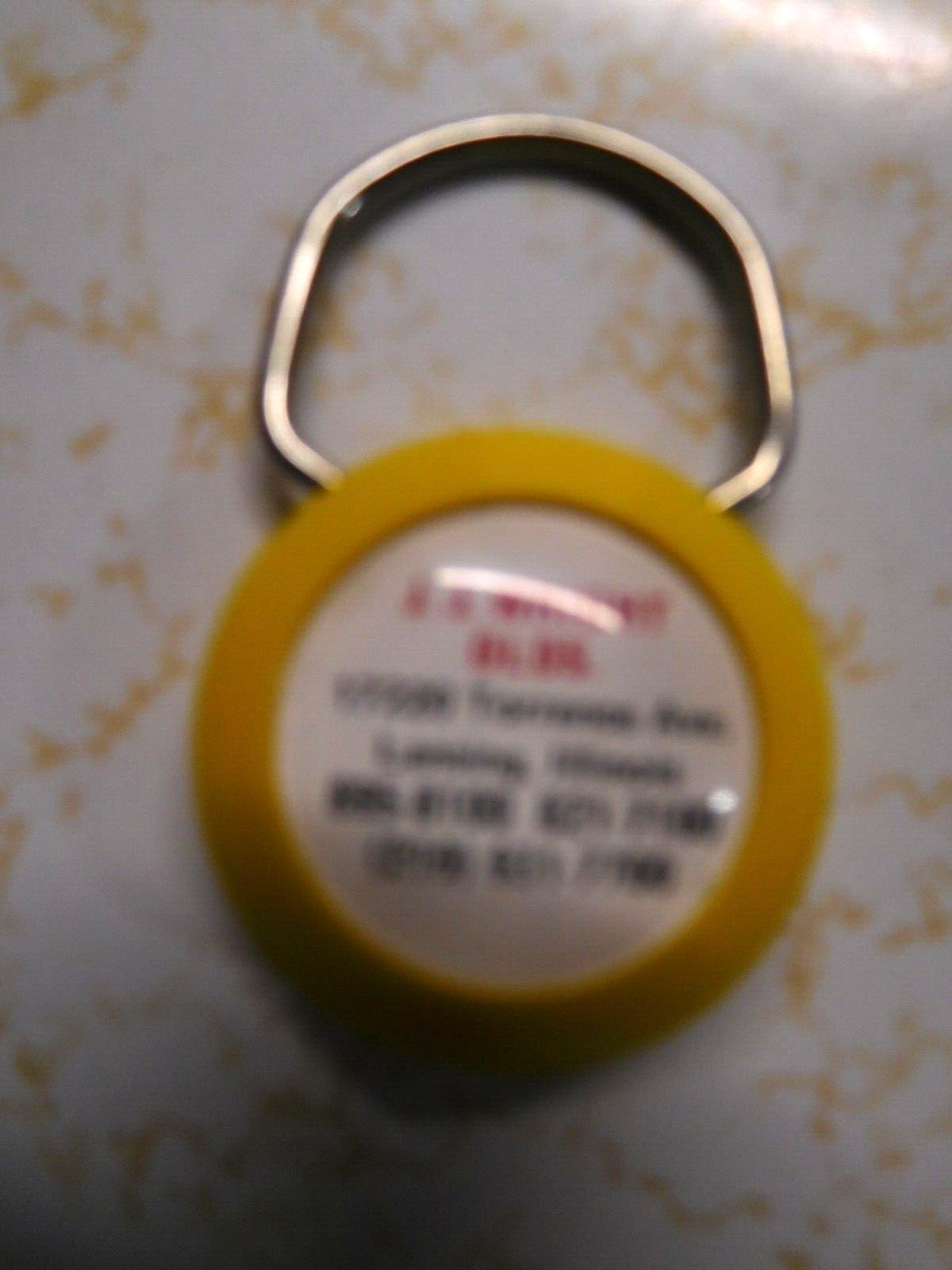 Vintage JJ Wright OLDS Lansing, ILL Round Yellow KeyChain
