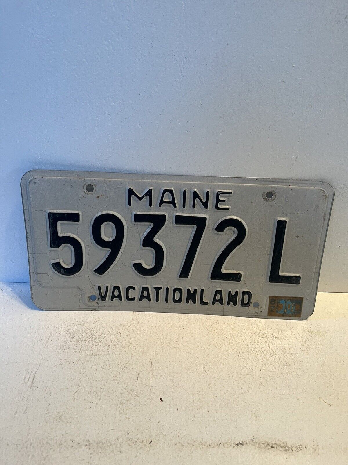 1987 stickered vintage Maine liscense plate vacationland