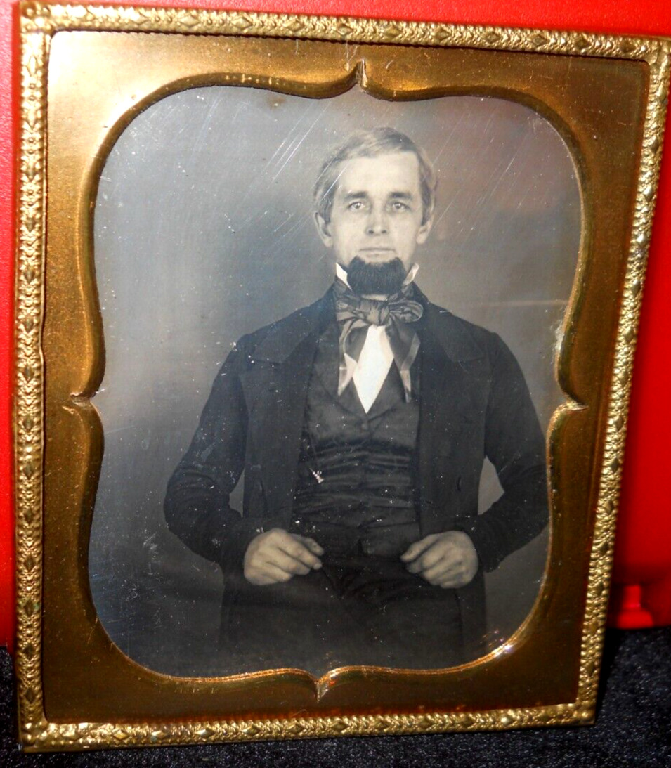 1/6th size Daguerreotype of middle aged man in brass mat/frame