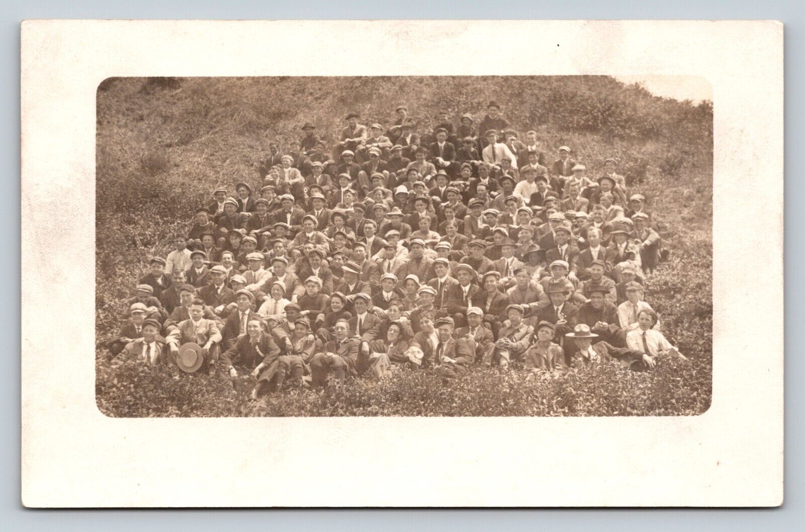 RPPC Large Crowd of Men & Boys Sit on Hill CYKO 1904-1920s VINTAGE Postcard 1322