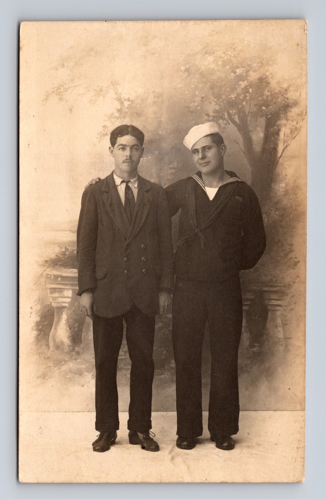 c1910-1924 RPPC Postcard Portrait of Two Men Sailor and Man in Suit Brothers?