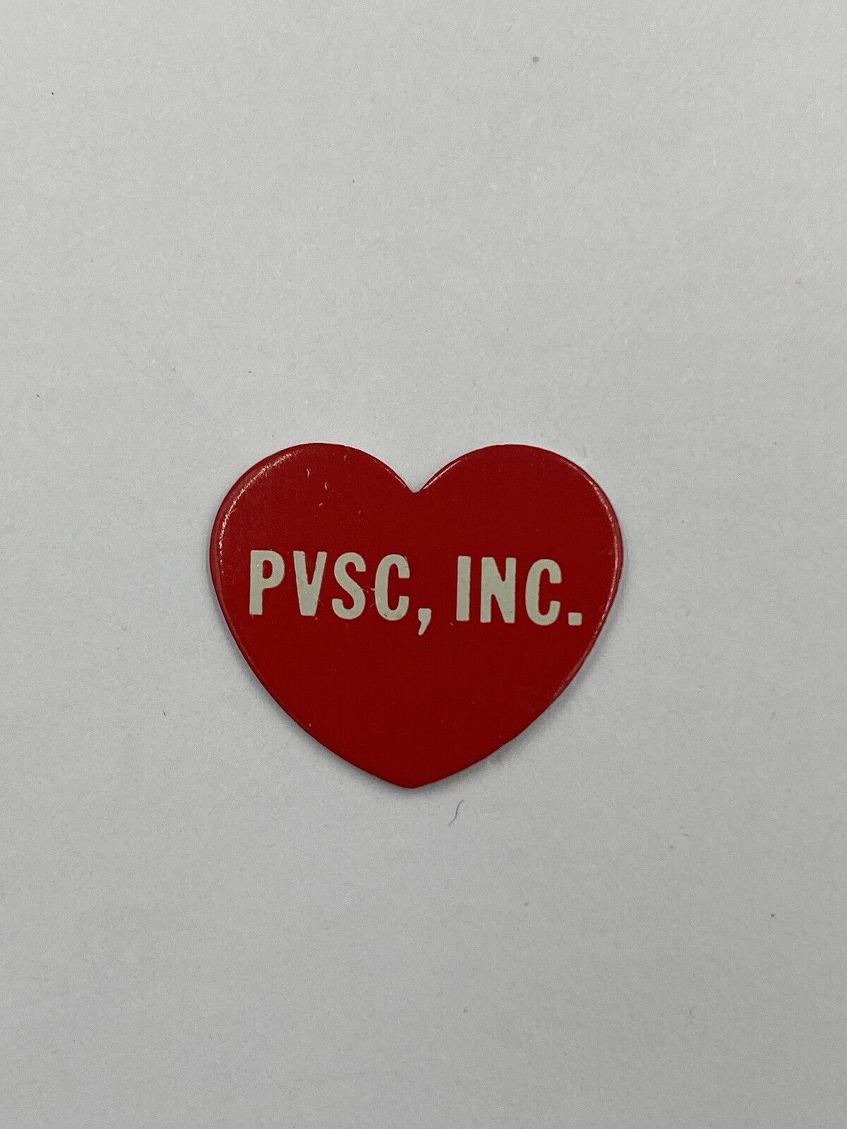 Vintage Red Heart Shaped PVSC, Inc Lapel Pin
