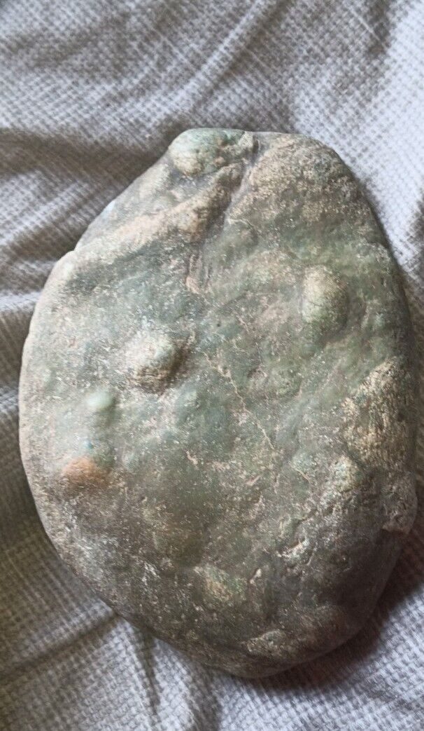 Unique Green Rock with bubbles on it