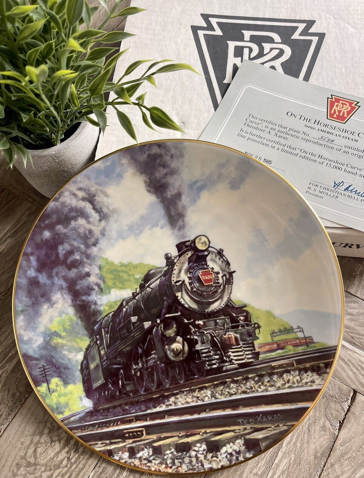AUTHENTIC FINE PORCELAIN PLATE ON THE HORSESHOE CURVE HAND NUMBERED BY T.XARAS
