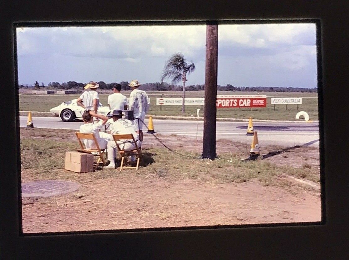 1960\'s Sebring FL 12 hour 1965 Race Team observing sitting near race track