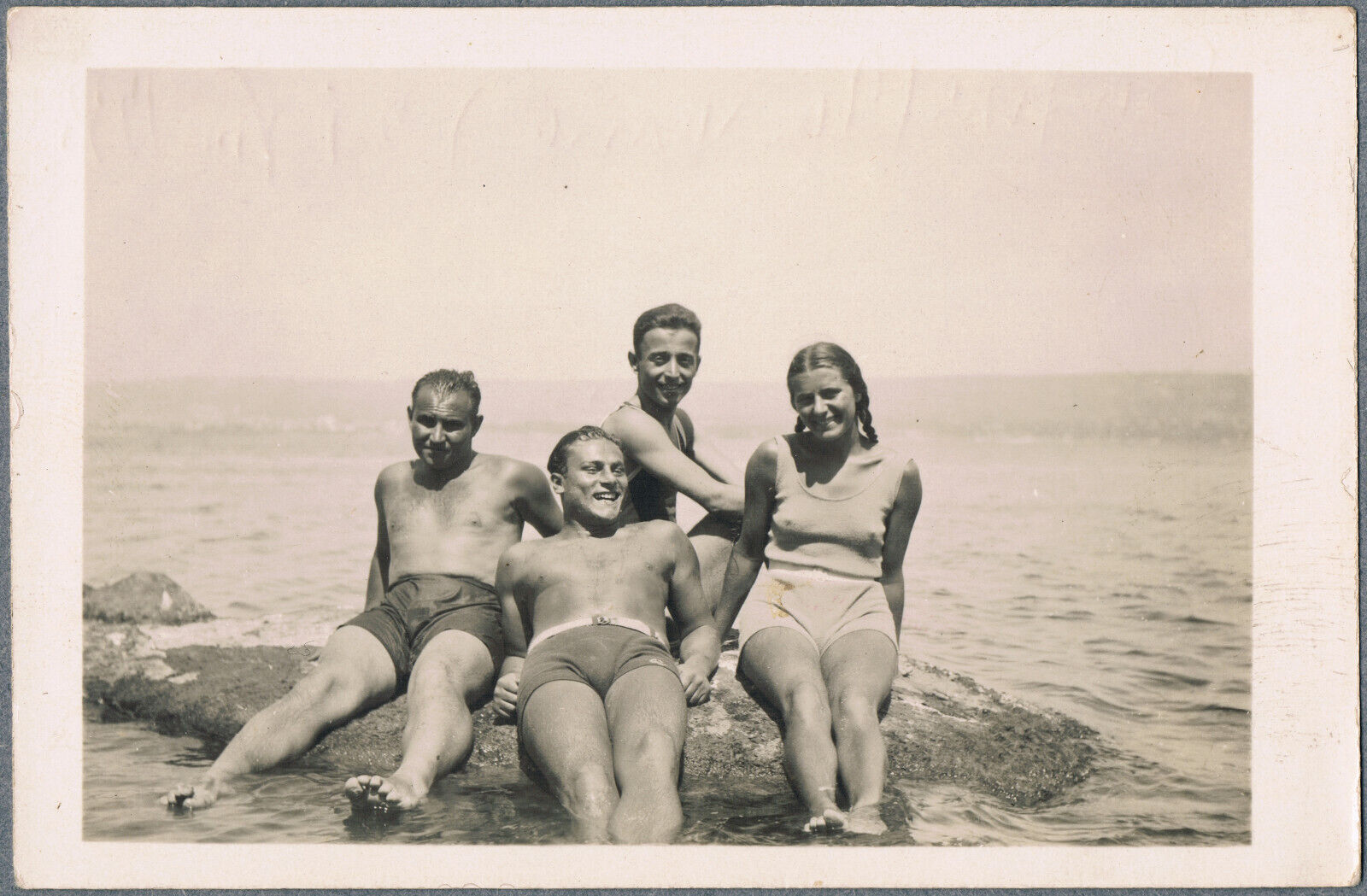 1930s Beautiful boys and girls in bathing suits on the beach Vintage photo