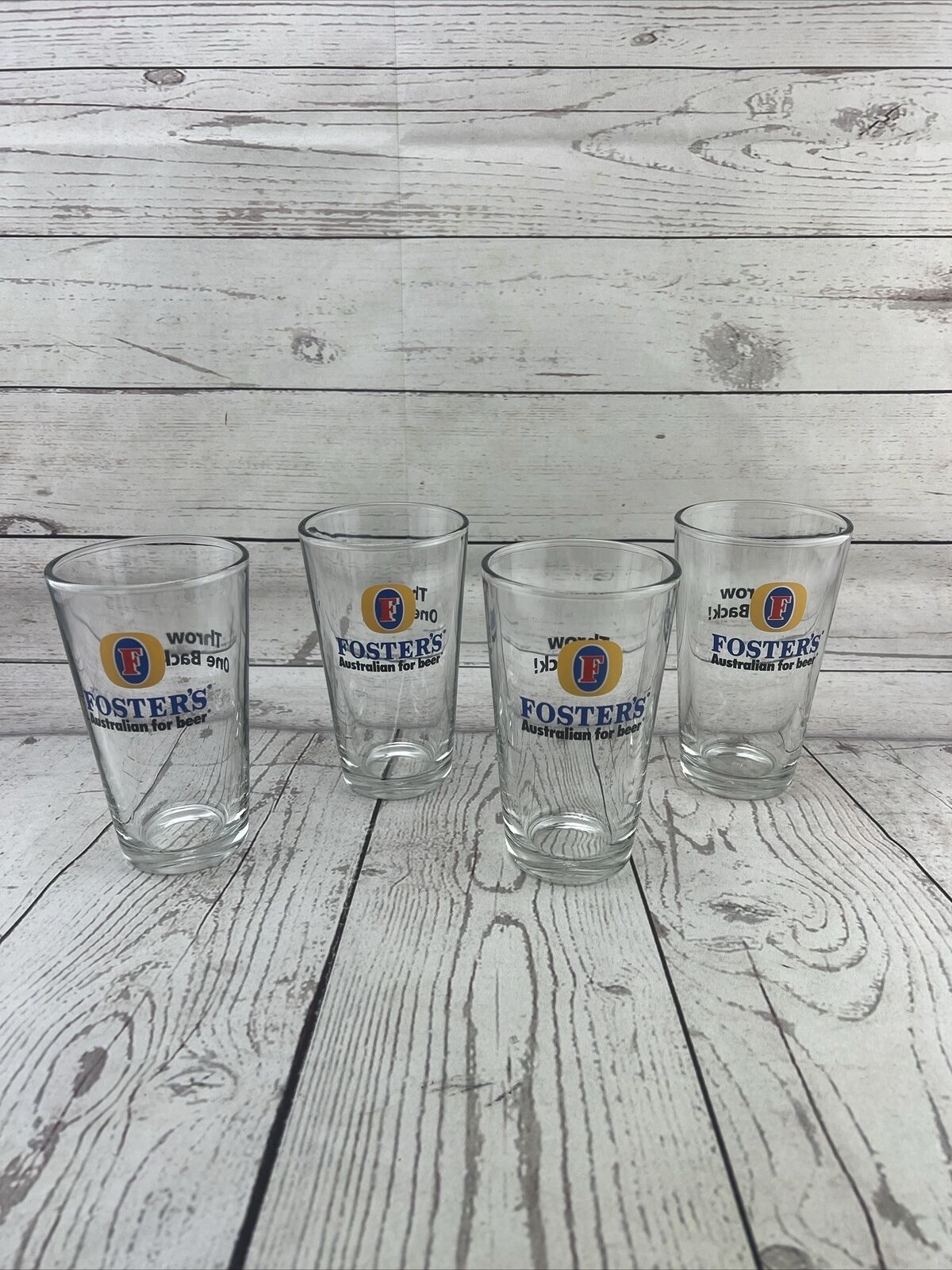 4 Fosters Pint Beer Glass 5.75 Tall 16 Ounce Gold Blue 