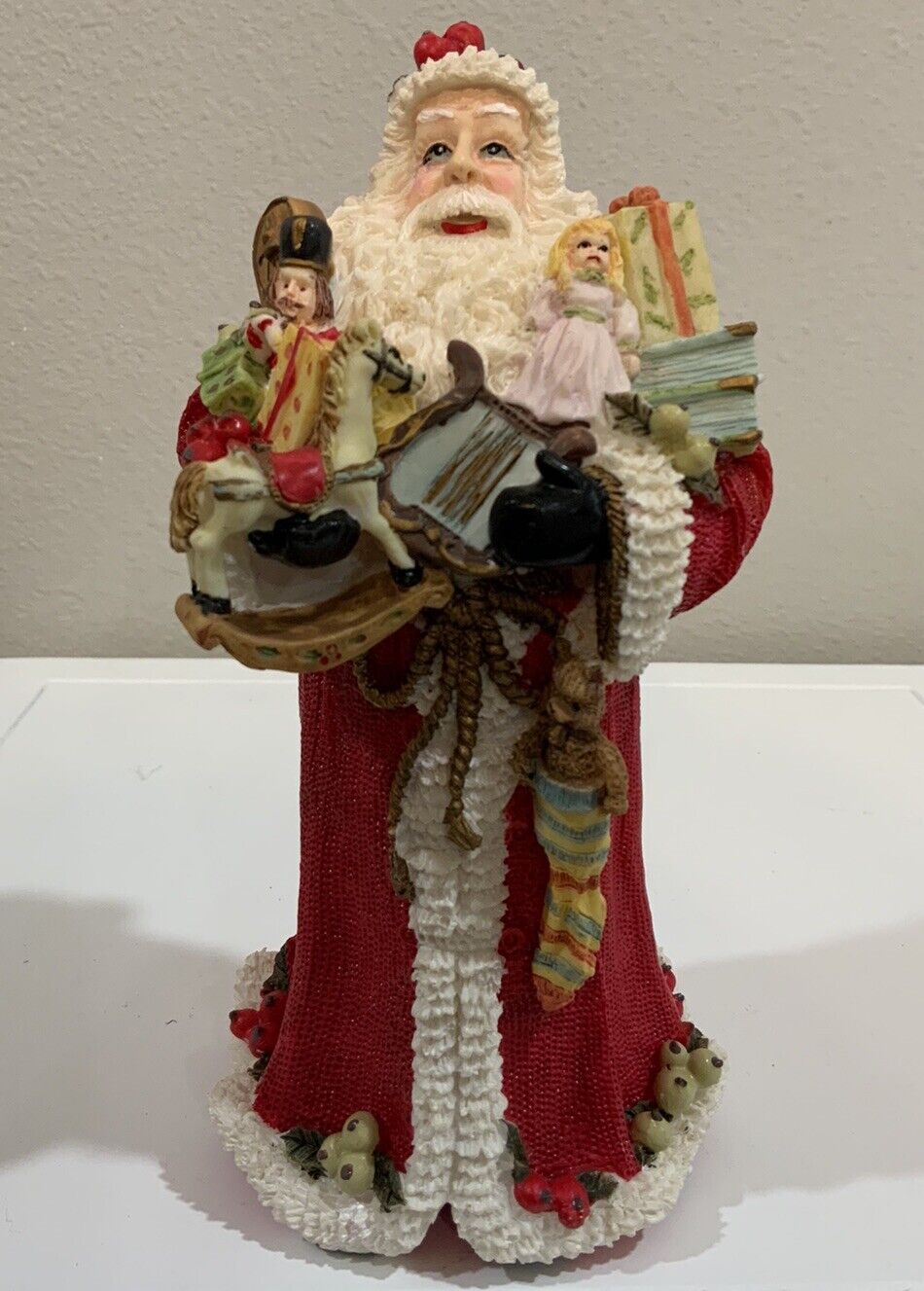 Vtg Resin Santa Claus Holding Toys Musical Instruments Book Holly Berry Figurine