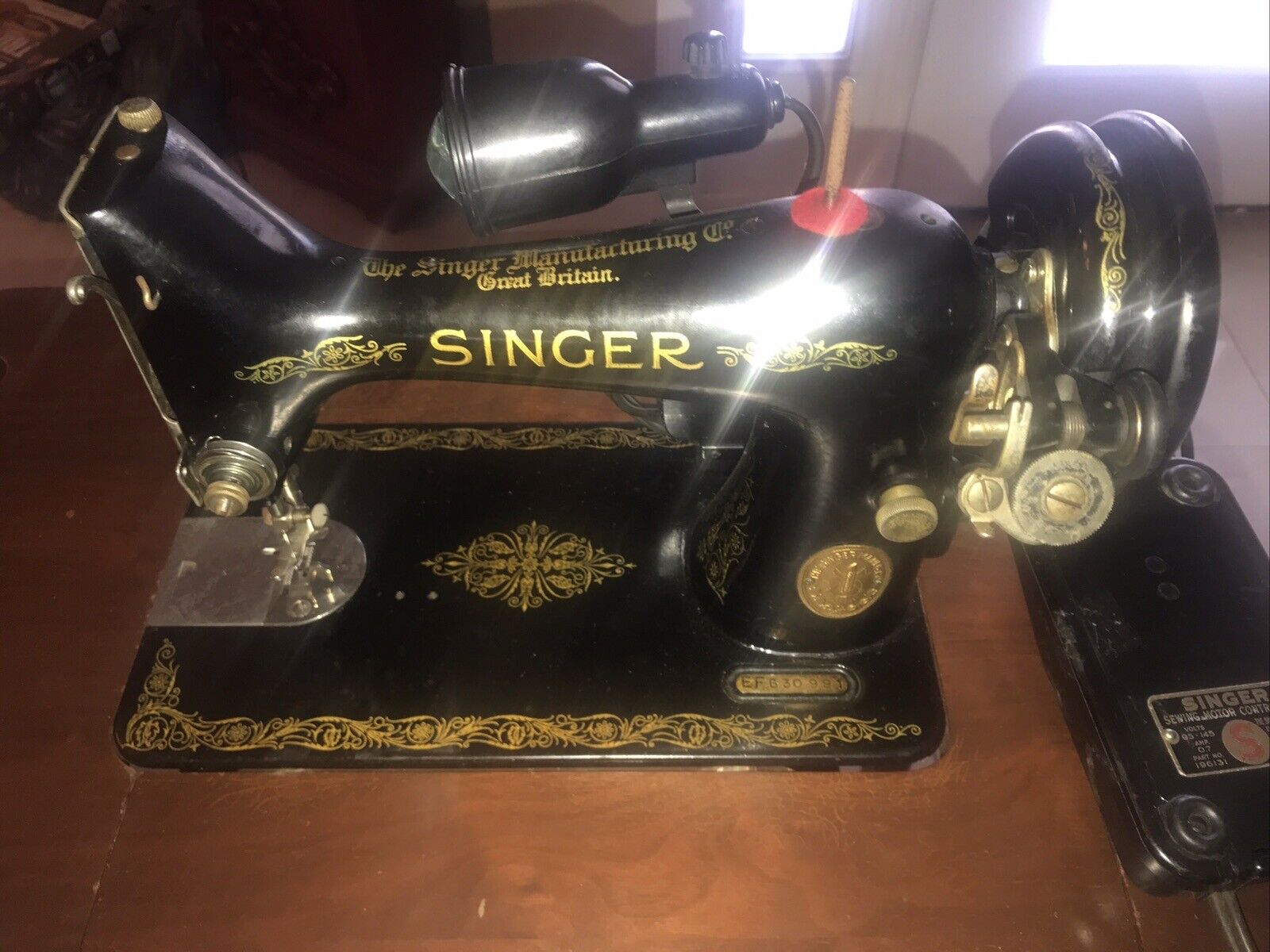 The Singer Manufacturing CoVintage Singer Sewing Machine With Light And Cabinet