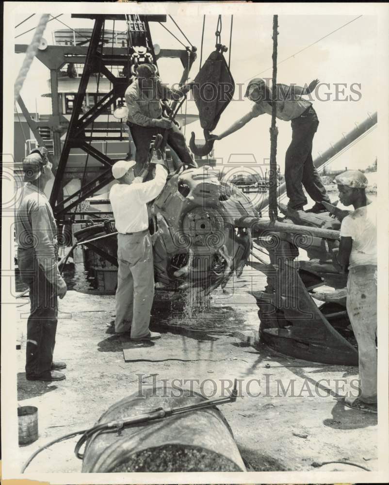 1955 Press Photo Workmen cutting head of a dredge in Fort Lauderdale - lrb02991