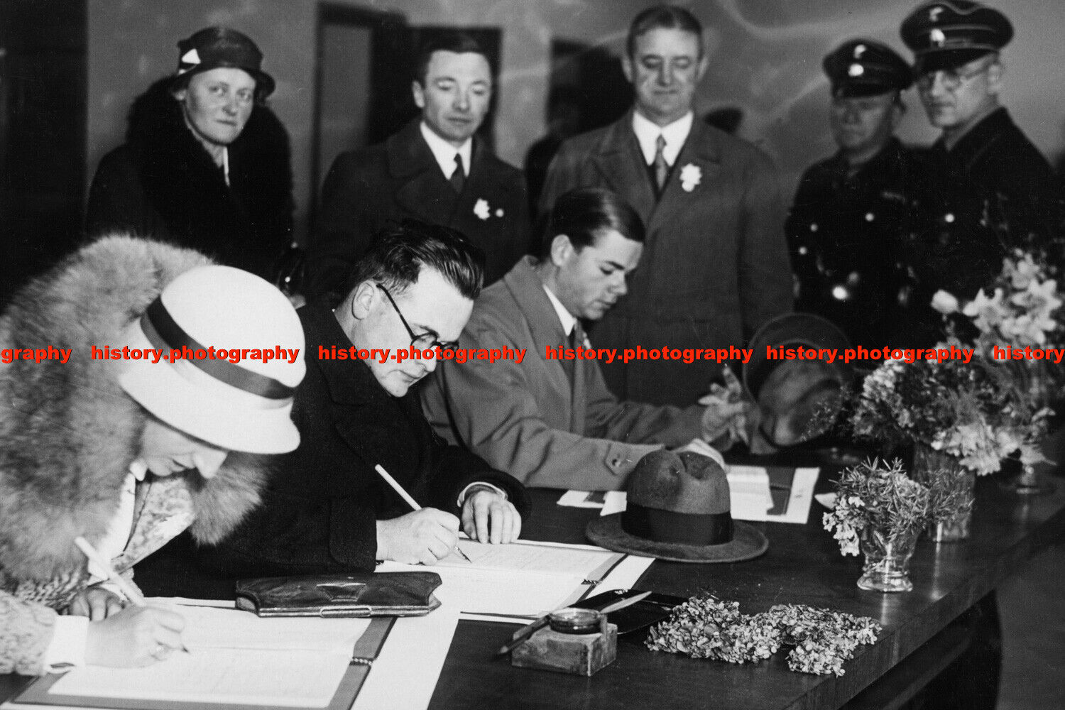 F017814 Men and women signing congratulatory lists for AH birthday Reich Chancel