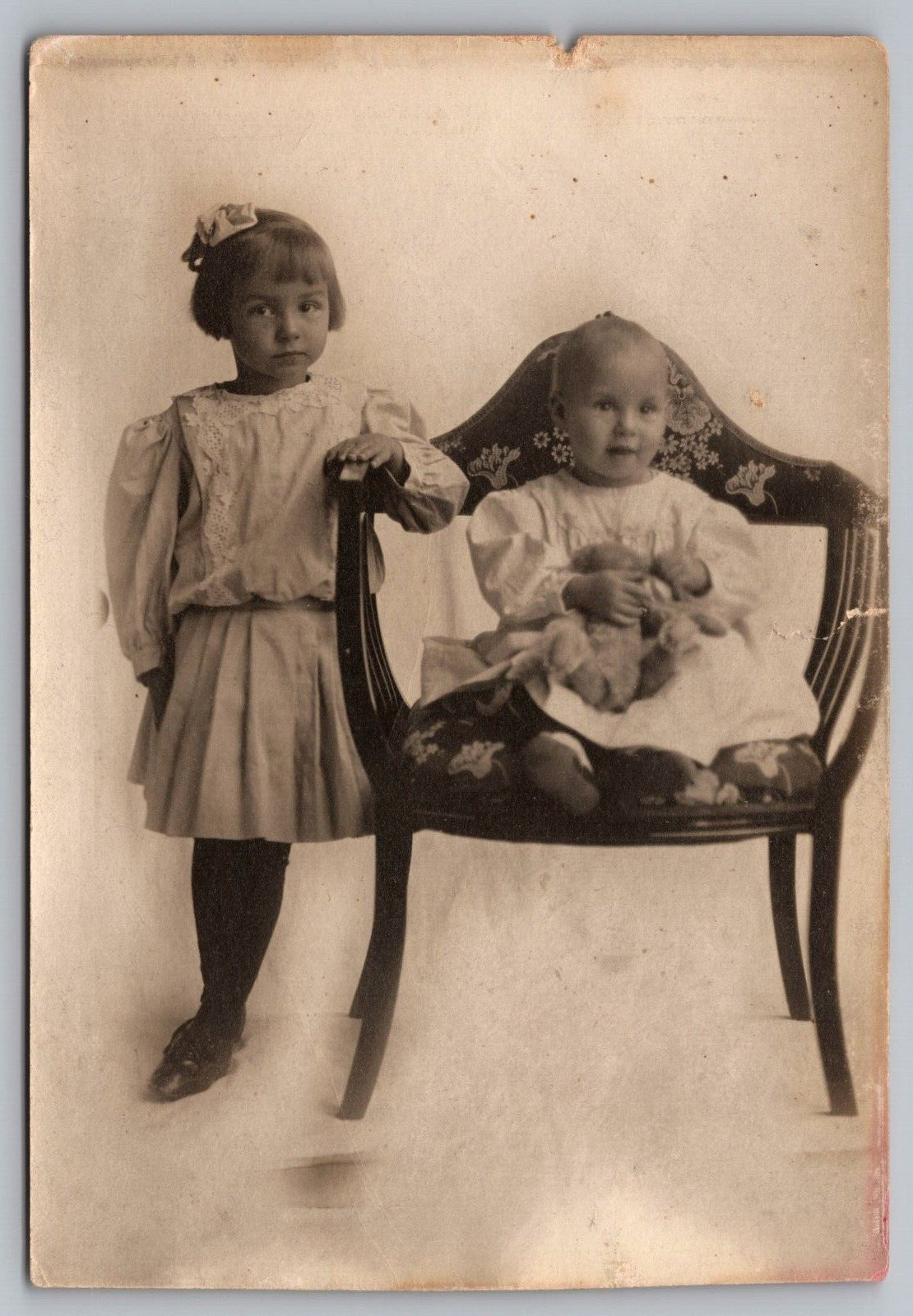 RPPC Postcard Little Girl Baby in a Chair with Teddy Bear Studio Portrait