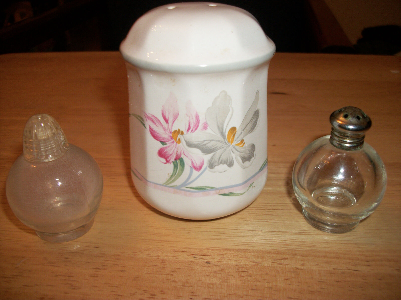 2 Small Clear Salt/Pepper Shakers-One is Irice & White Shaker w/ Floral Design 