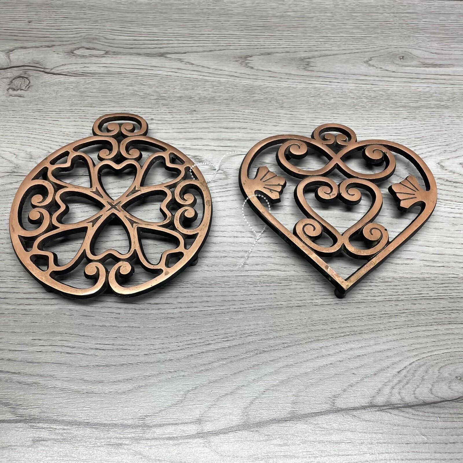 Pampered Chef Trivets One Round and One Heart Shaped. Copper color Heavy