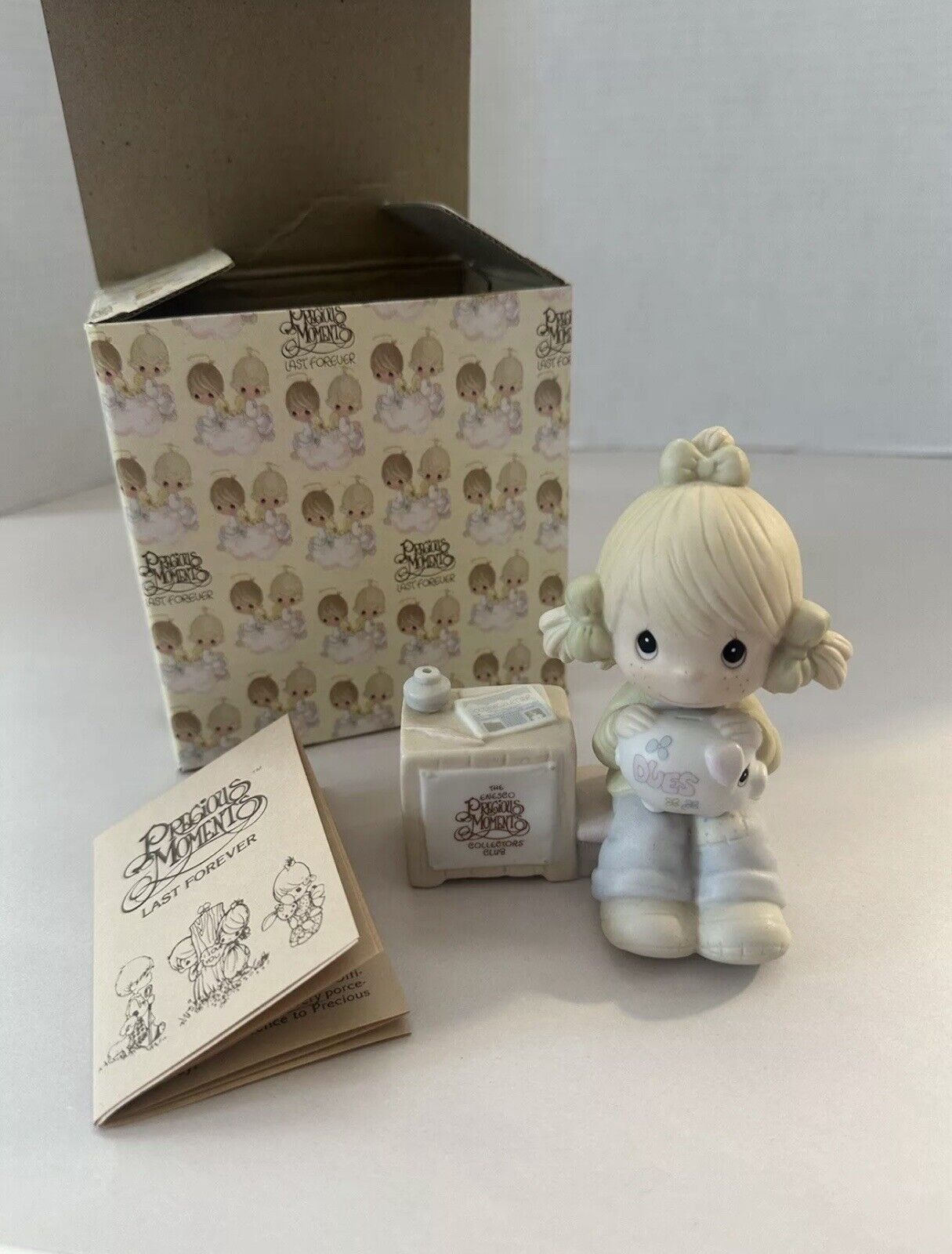 Precious Moments Little Girl with Piggie Bank. Comes with Box