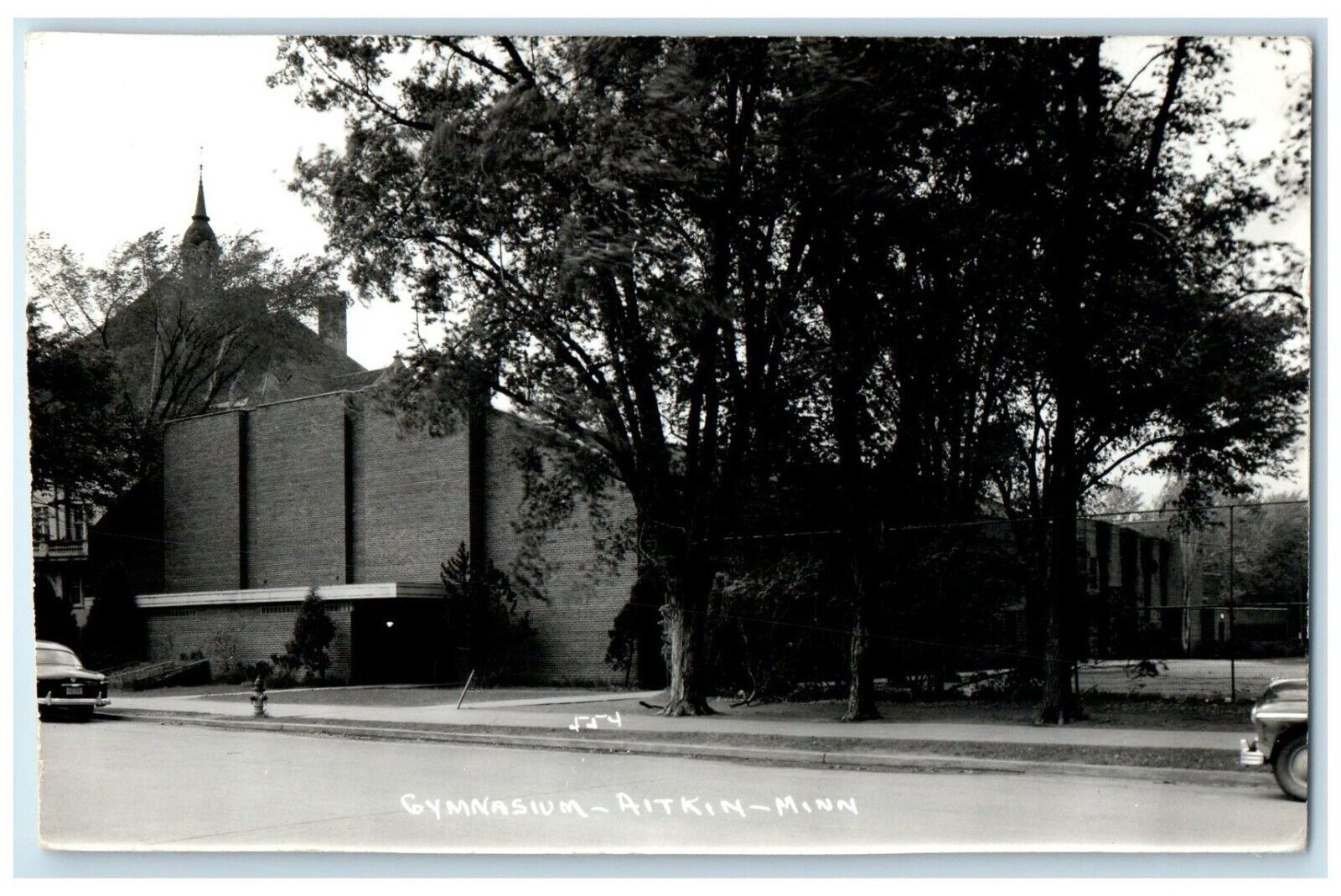 c1950\'s Gymnasium Scene Street Cars Aitkin Minnesota MN RPPC Photo Postcard