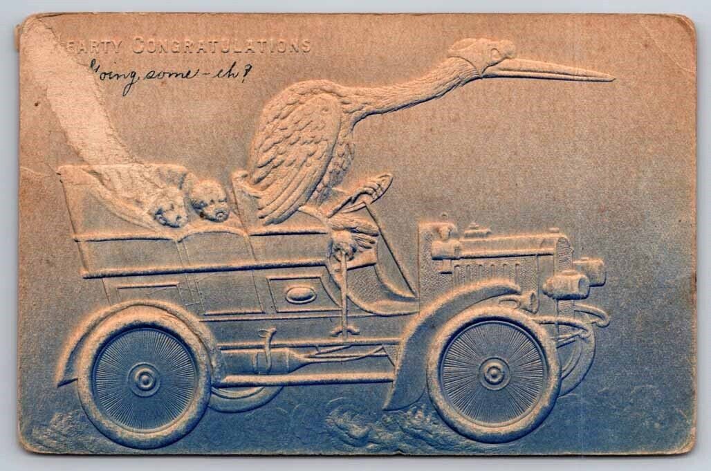 eStampsNet - Stork Drives Car w/ Twin Babies in Back Seat Raised Embossed 1908