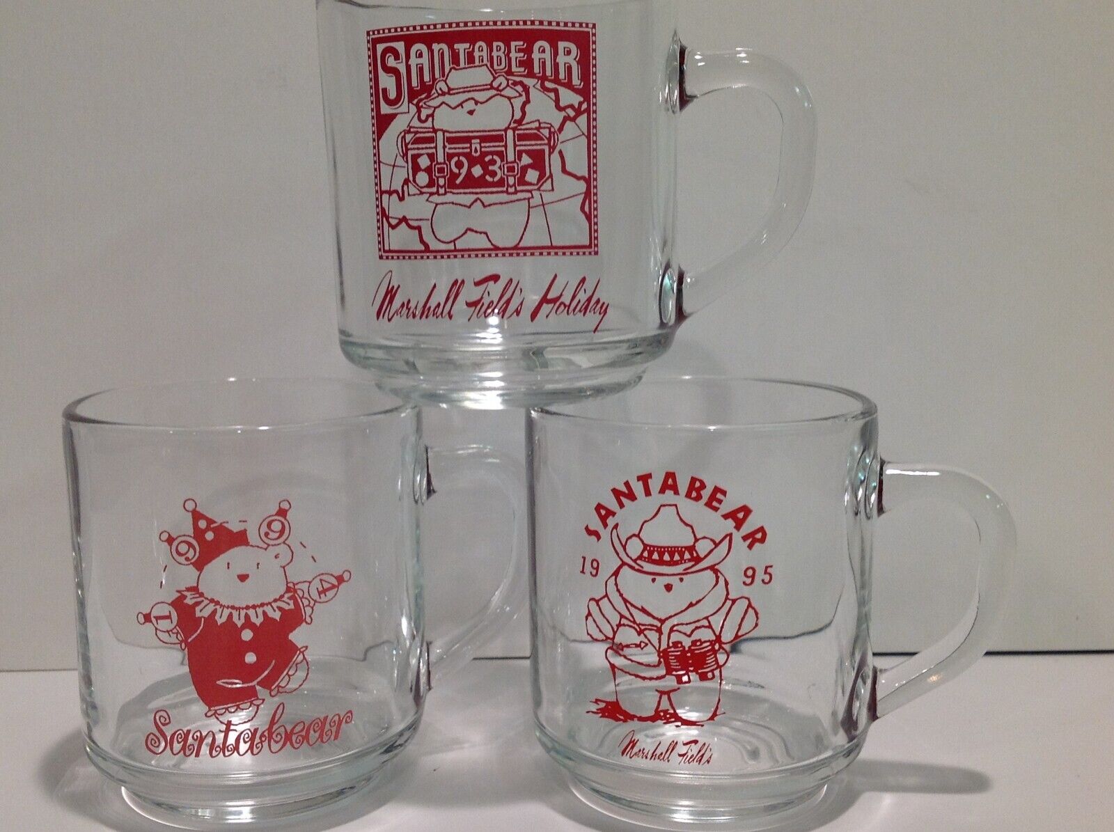 3 Marshall Field’s Christmas Holiday Santa Bear Glass Mugs 1993 1994 1995
