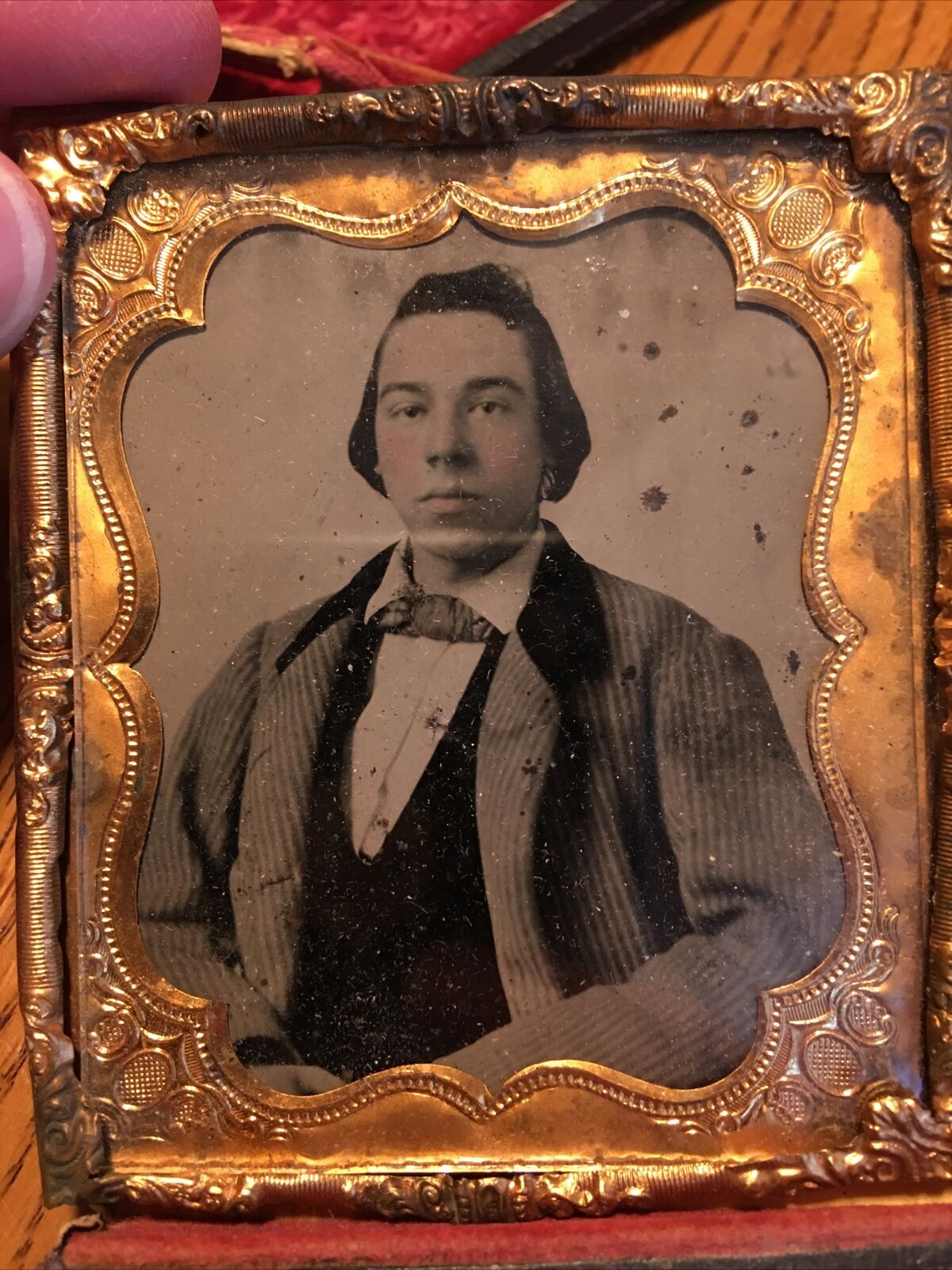 Sharp 1/6th size tintype of young man in brass mat/frame