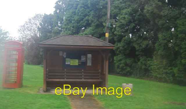 Photo 6x4 Shelter and Telephone box on a very wet day in Ellen\'s Green  c2010