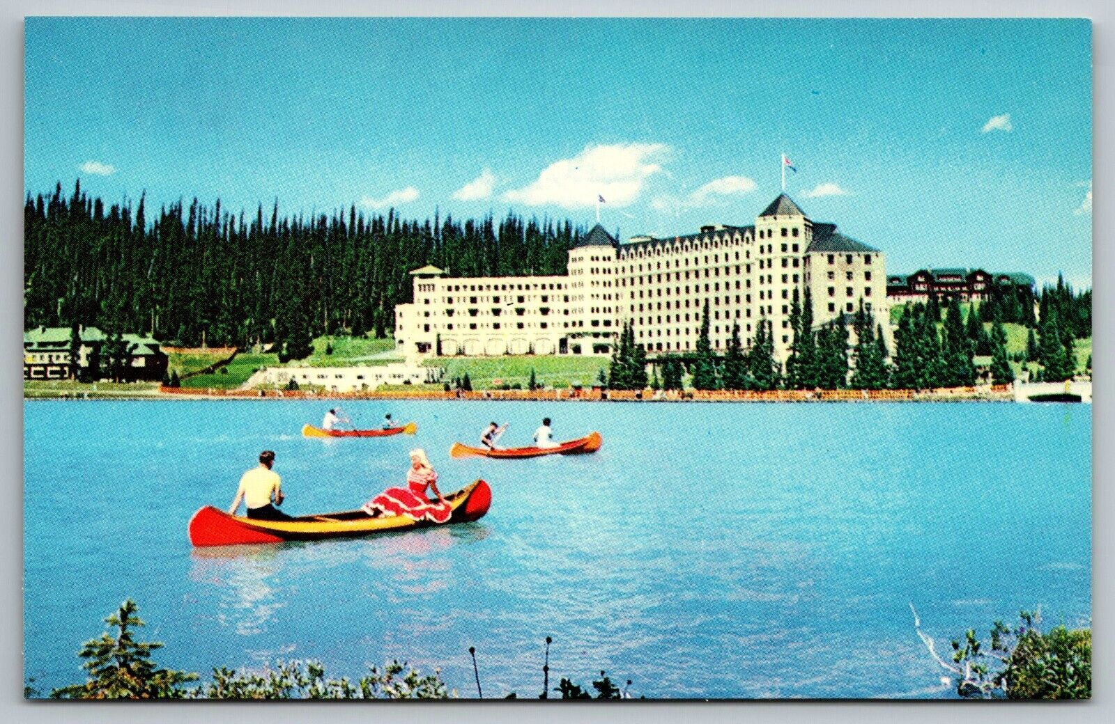 The Chateau Lake Louise canoeing AB Canada PostCard c1960s