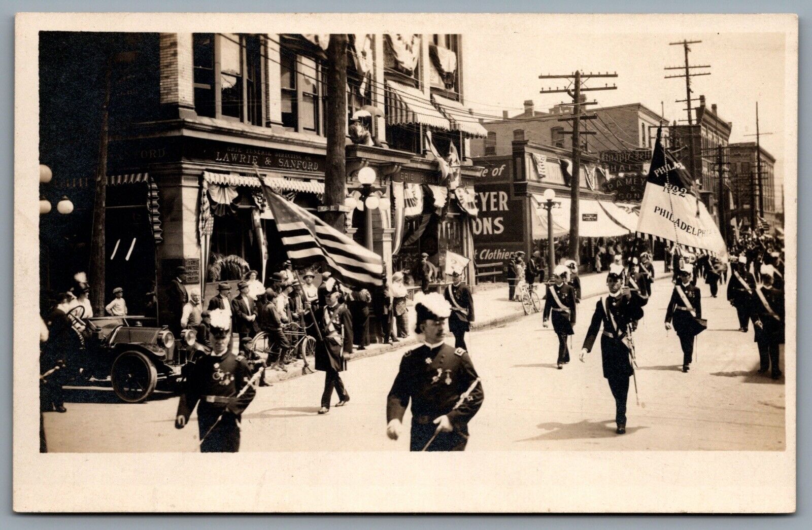 Postcard RPPC c1913 Erie PA Perry Centennial Parade Street View Shops Flags A