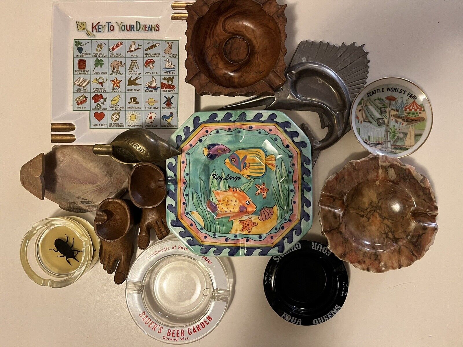 A collectors dozen unique ashtrays made of just about everything, cleaning house