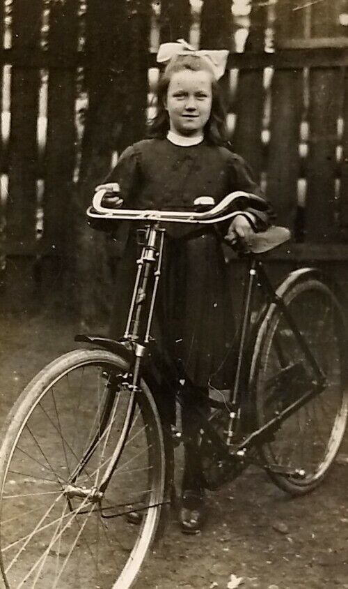 Antique 1920 RPPC Cute Girl Triumph? Bicycle T.I.C. Real Photo Postcard Vtg