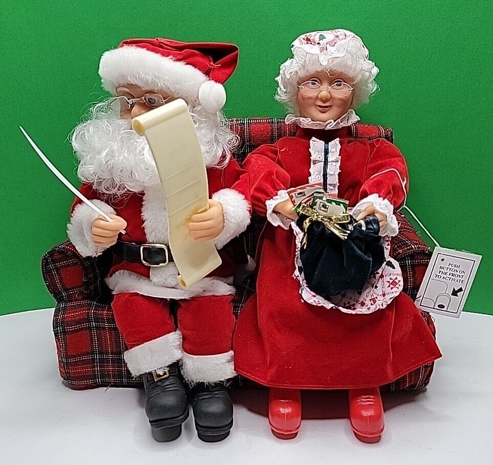Vintage 1995 Gemmy Animated Santa and Mrs. Claus Sitting on the Couch.