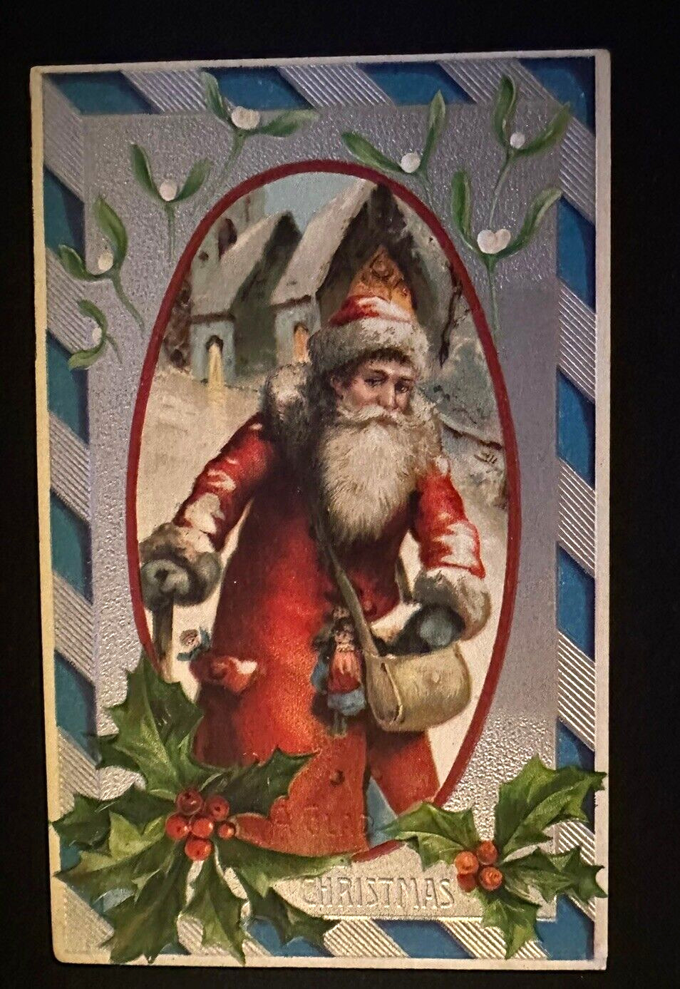 Long Red Robe Santa Claus w. Walking Stick~Village Scene~Christmas Postcard~k474