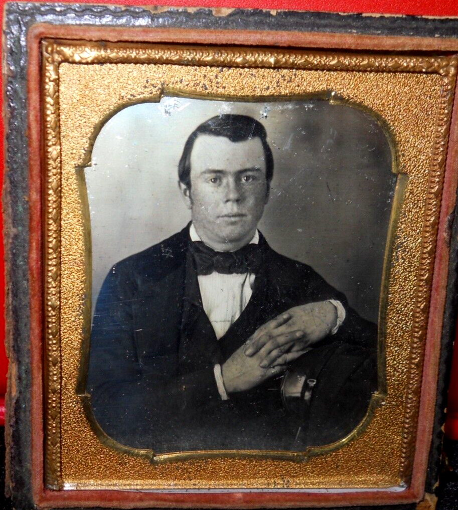 1/6th size Daguerreotype of young man in half case