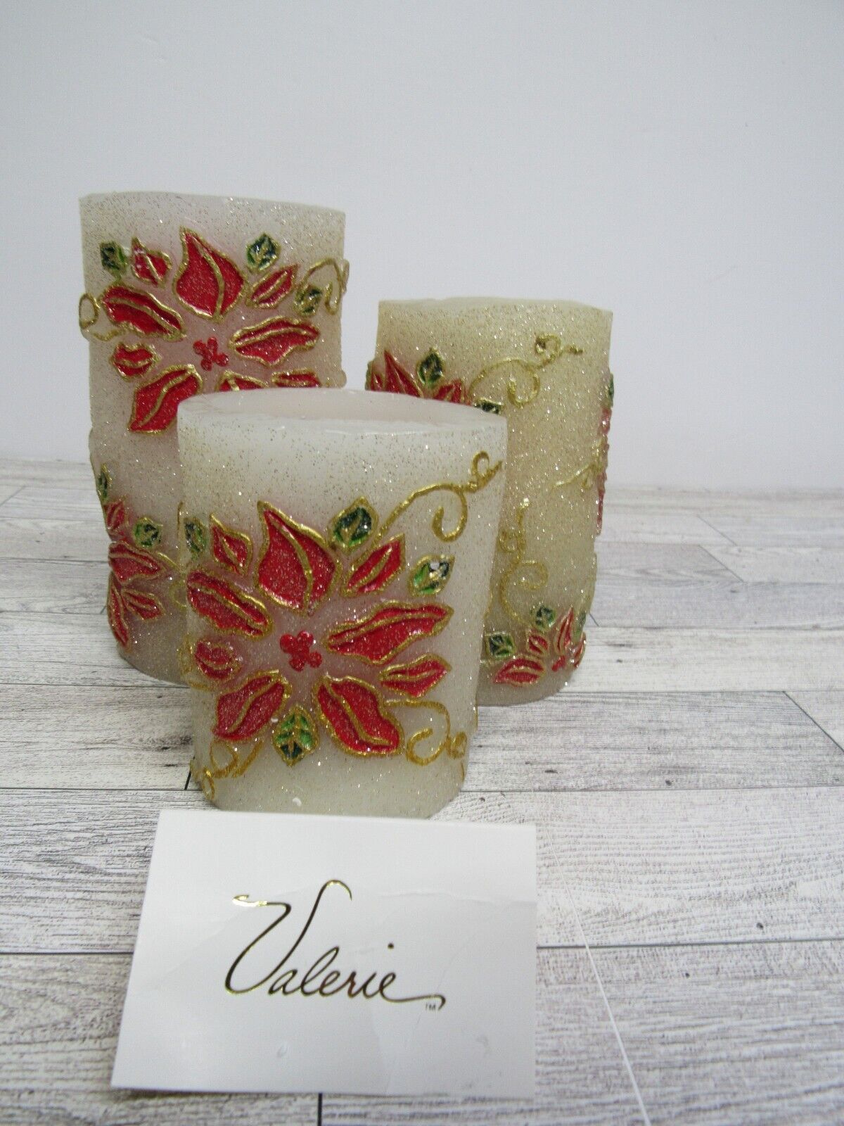 Valerie parr hill bay leaf collection poinsettia embossed flameless candle.