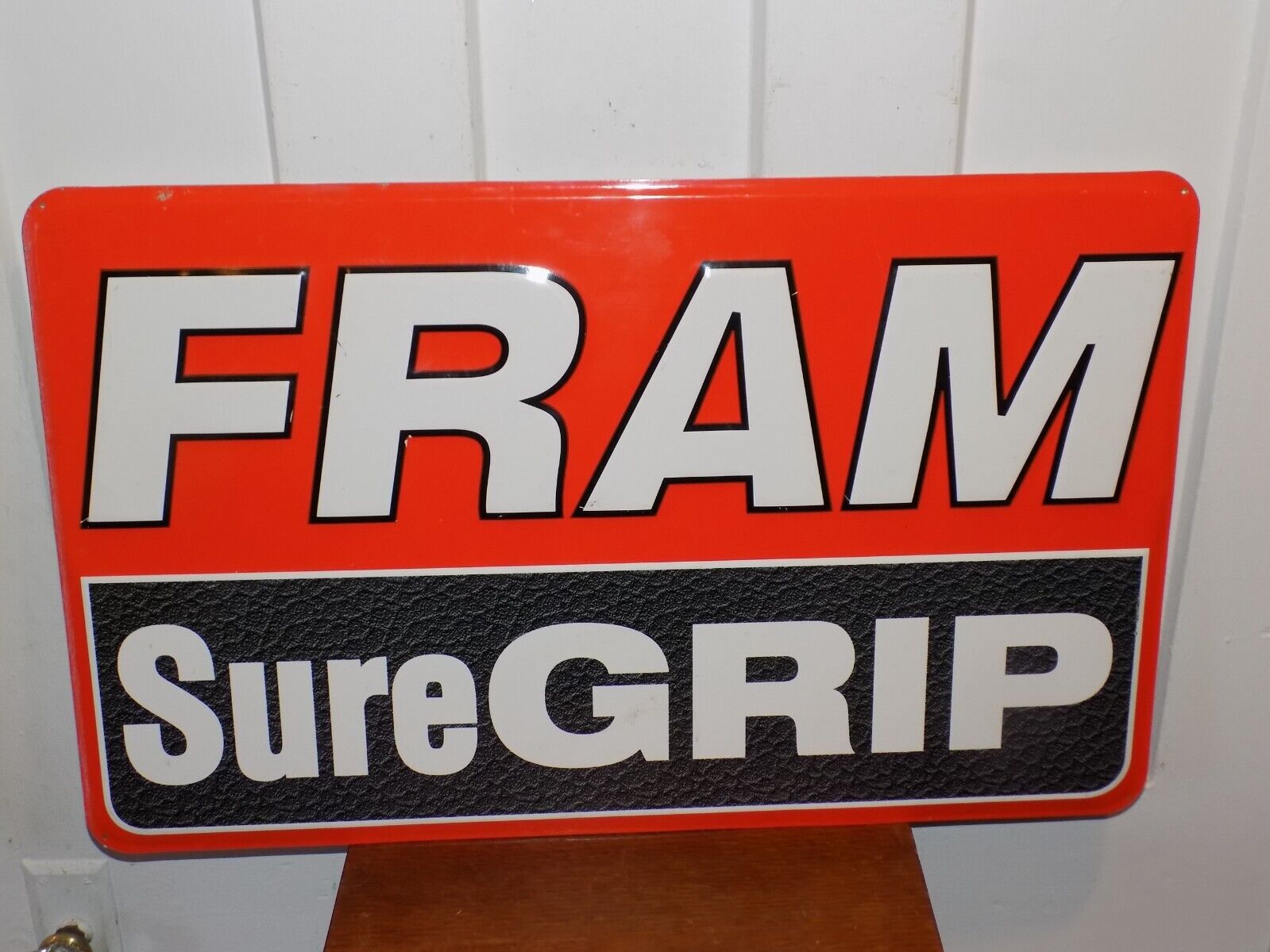 Vintage Fram Sure Grip Embossed Metal Sign