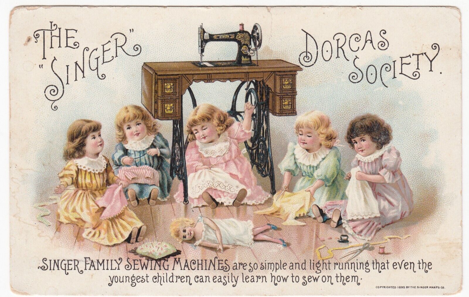 c1895 Singer Sewing Mfg Co.~Dorcas Society~Girls Sewing Doll Clothes~Trade Card