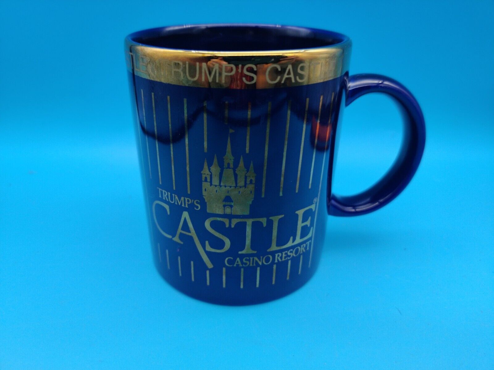 Donald Trump's Castle Hotel and Casino By the Bay Atlantic City NJ Navy Gold Mug