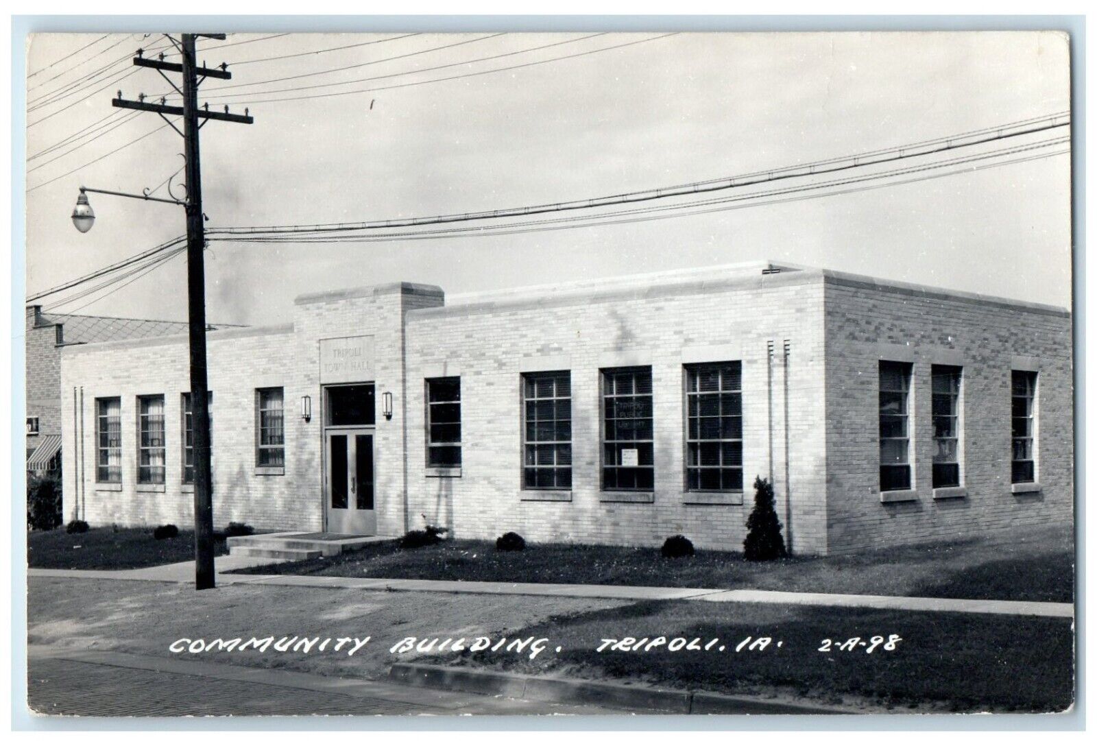 c1940's Community Building Street Scene Tripoli Iowa IA RPPC Photo Postcard