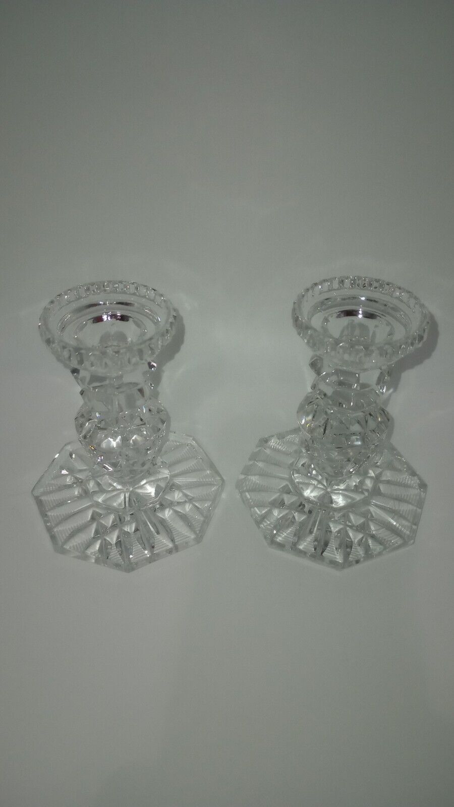 A Pair Of Vintage Cut Crystal Star Design Candle Holders 