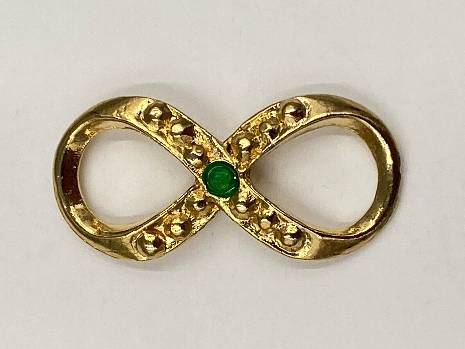 Vintage HC Harriet Carter Gold Colored Green Rhinestone Infinity Lapel Pin
