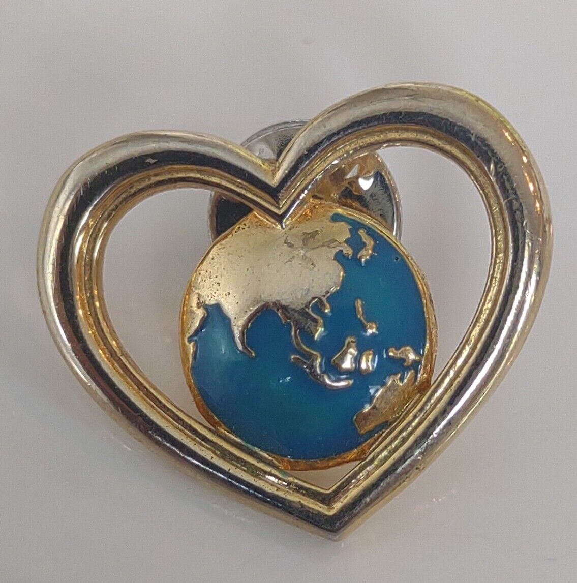 Avon Gold Toned Heart Earth Lapel Pin