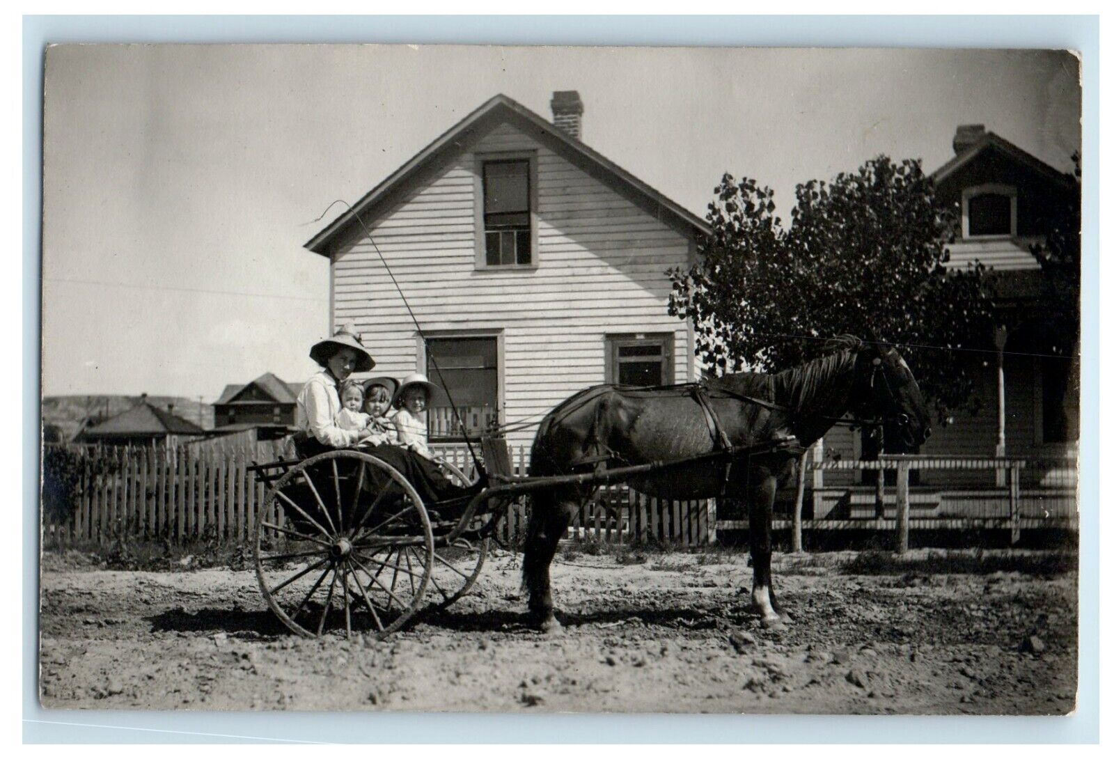 c1910's Mother Daughters Kids Horse Chariot Whip Houses RPPC Photo Postcard